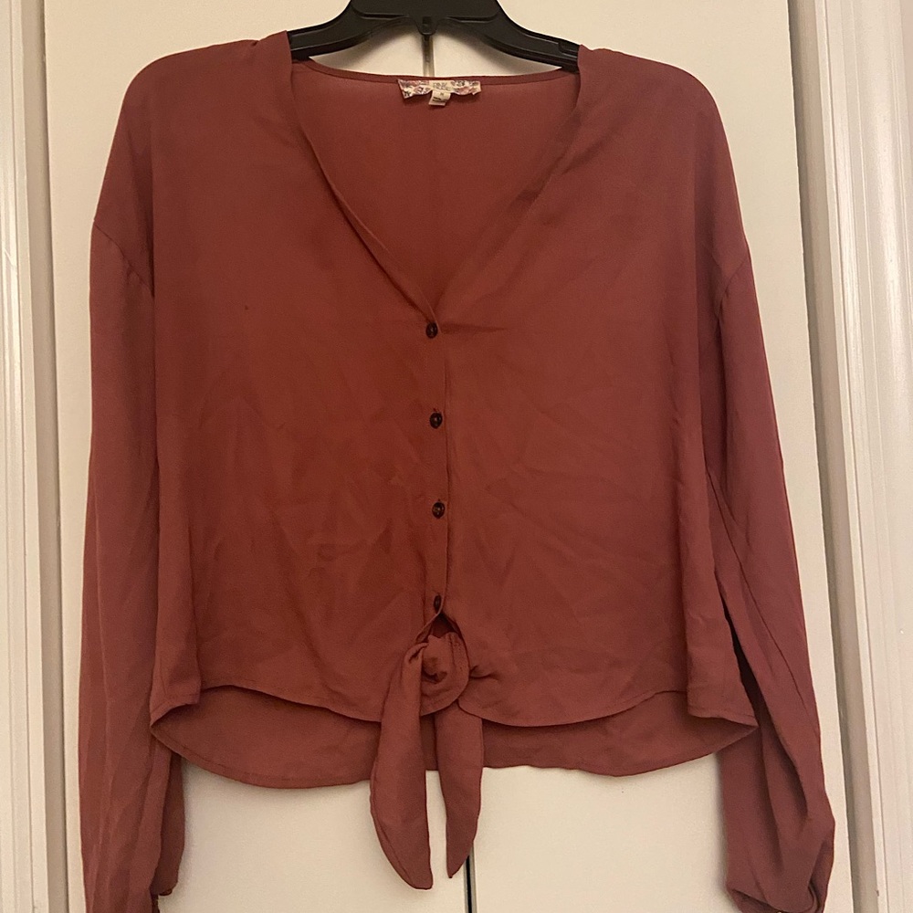 Long sleeve pink buttoned down blouse